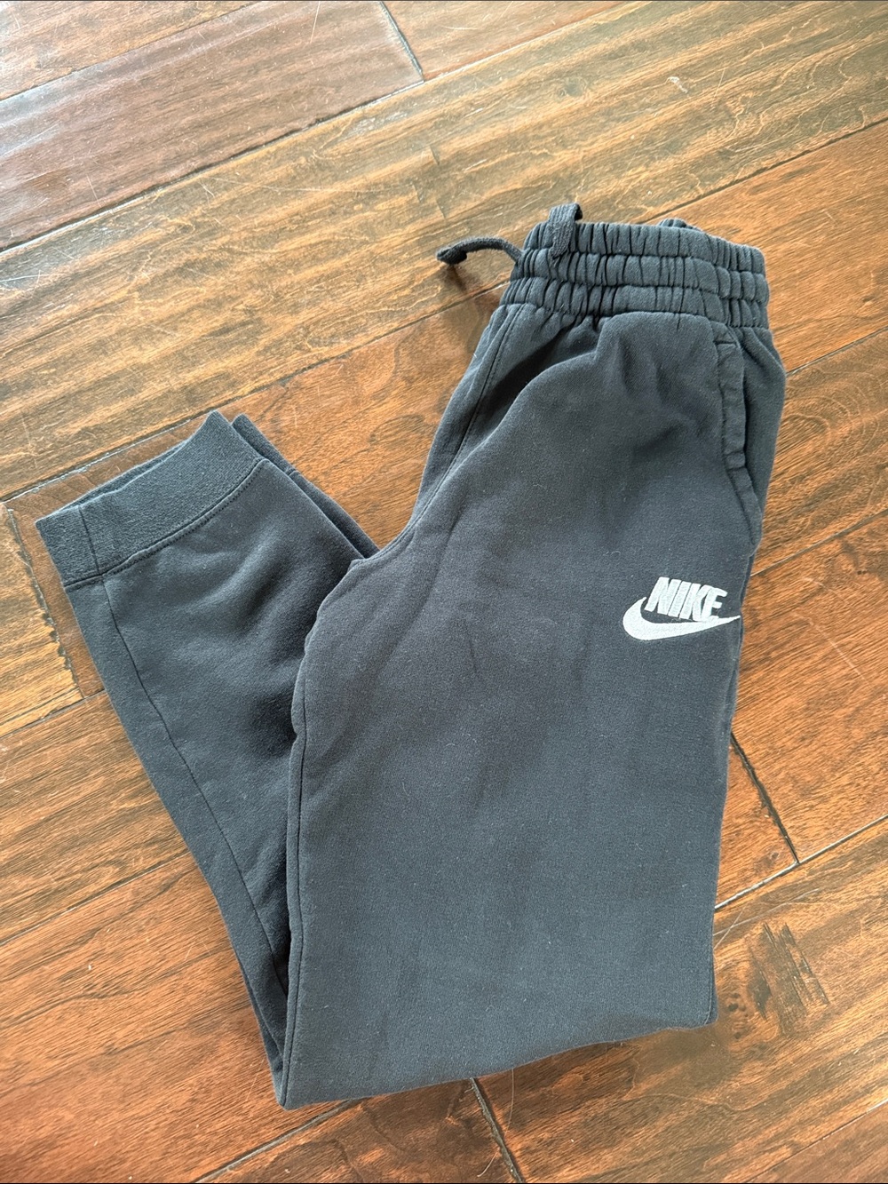 Nike Kids Black Sweatpants with White Swoosh
